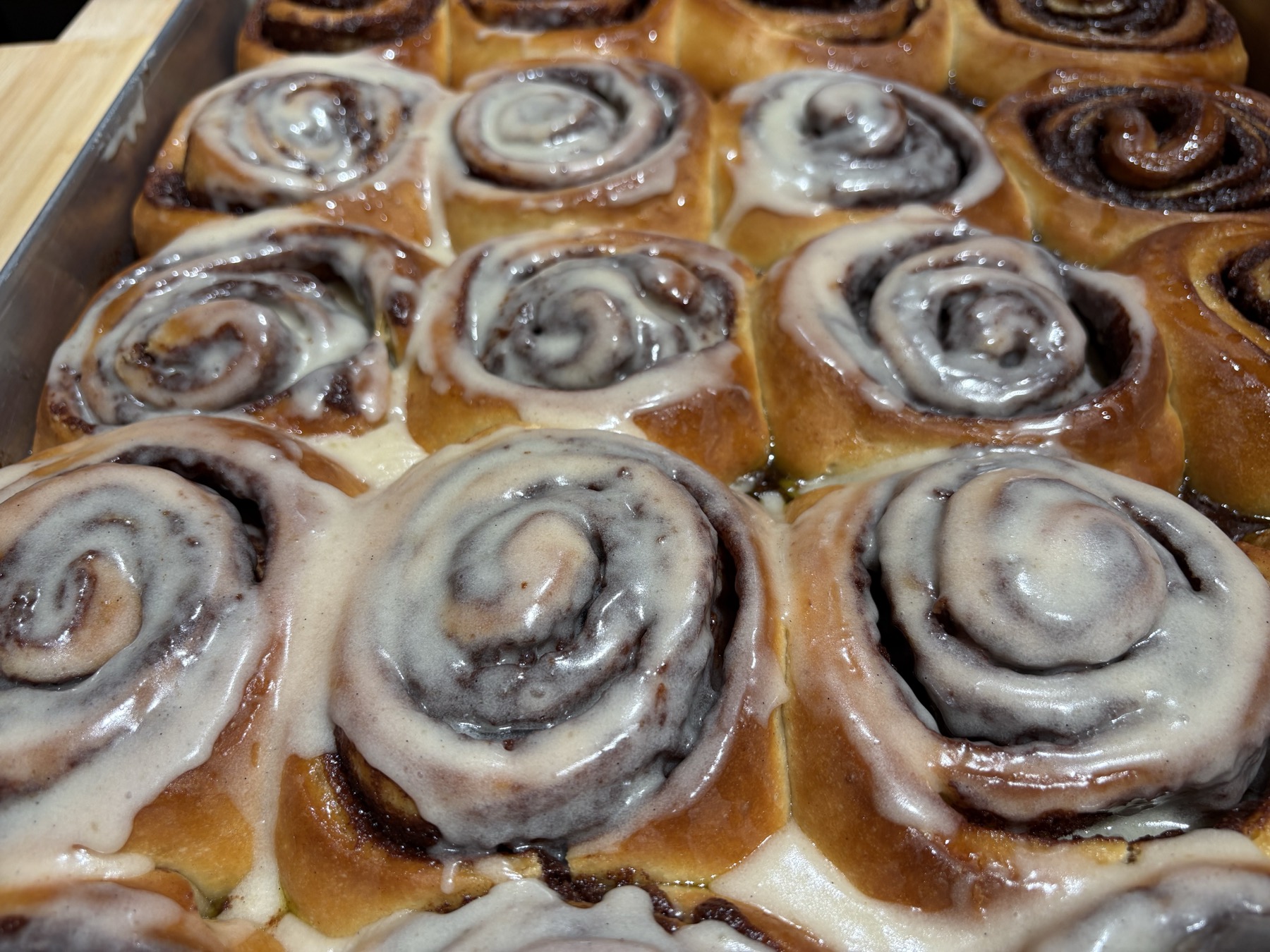 Tray of freshly glazed Cinnery cinnamon rolls